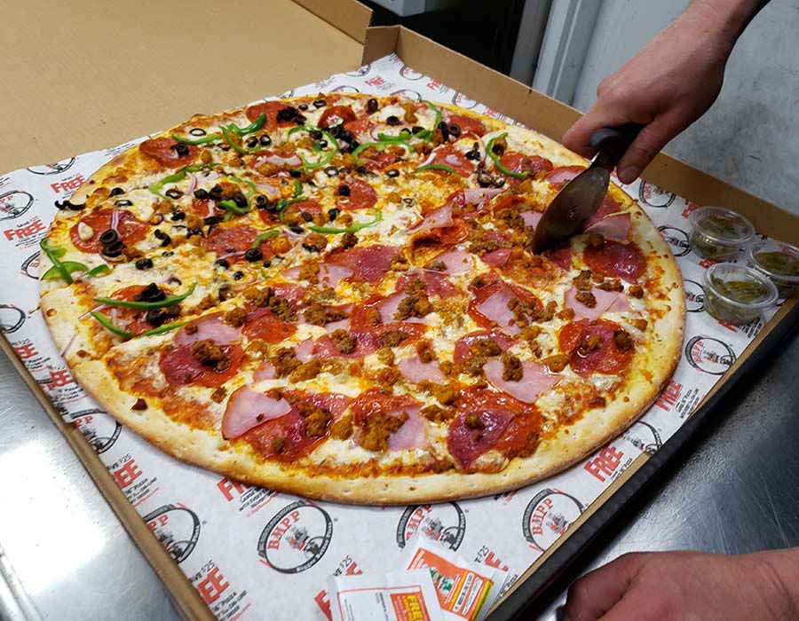 Cooked Pizza Slicing